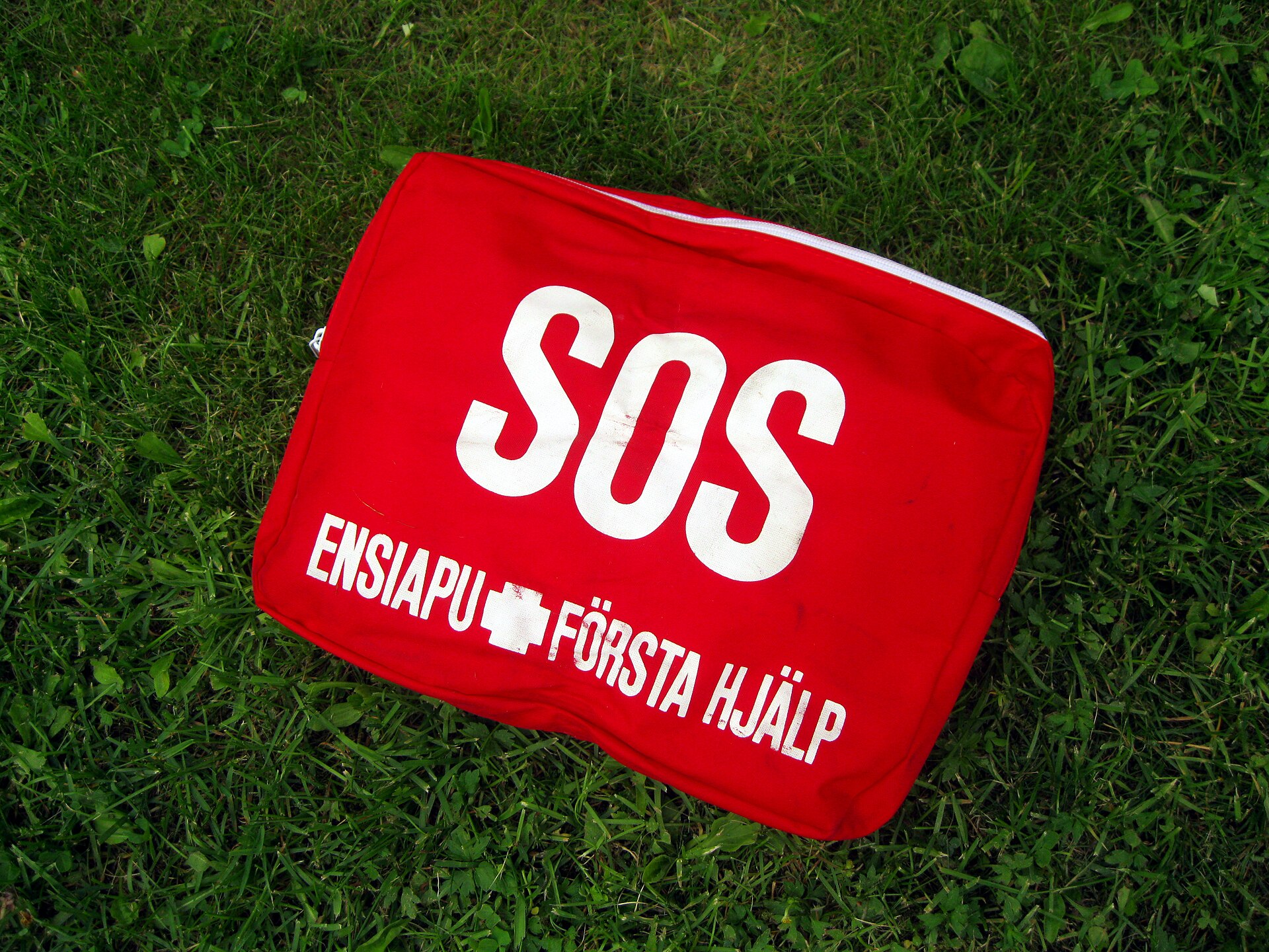 An open first aid kit with medical supplies